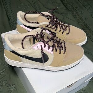 Tan and Black Air Jordan’s with Pink Accents